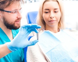 implant dentist explaining cost of dental implants in Alhambra