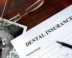 Insurance paperwork for the cost of dental implants in Alhambra