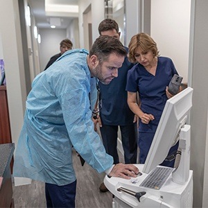 Dentists looking at chairside computer