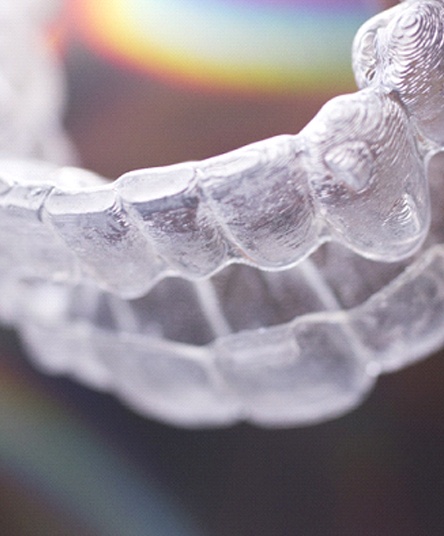 An up-close image of a clear aligner used as part of a patient’s treatment with Invisalign in Alhambra