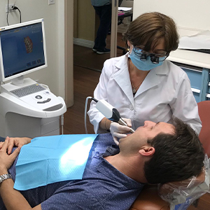 Dr. Gashparova treating dental patient
