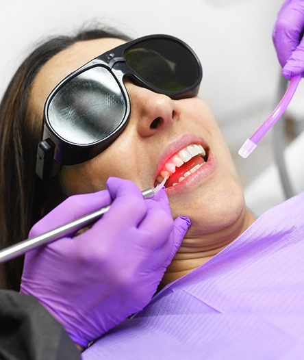 Woman undergoing laser periodontal surgery 
