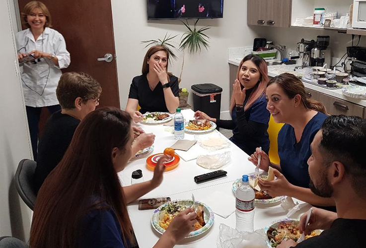 Dental team members eating together