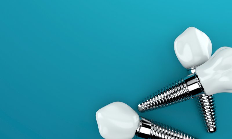 three single tooth dental implants, complete with the posts and dental crowns 