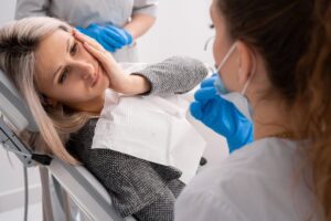 an emergency dentist speaking with a patient